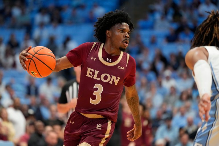 Elon Phoenix guard TK Simpkins (3) dribbles in the first half at Dean E. Smith Center.