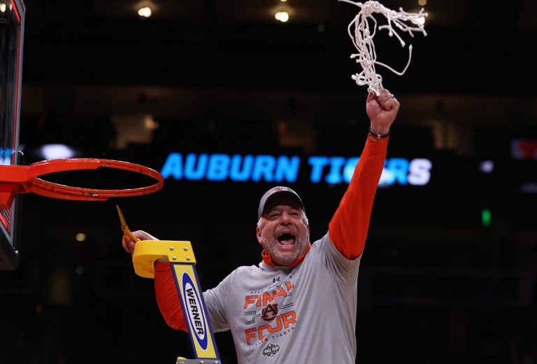 Auburn Tigers head coach Bruce Pearl cuts down the net after winning the South Regional final of the 2025 NCAA tournament against the Michigan State Spartans at State Farm Arena.