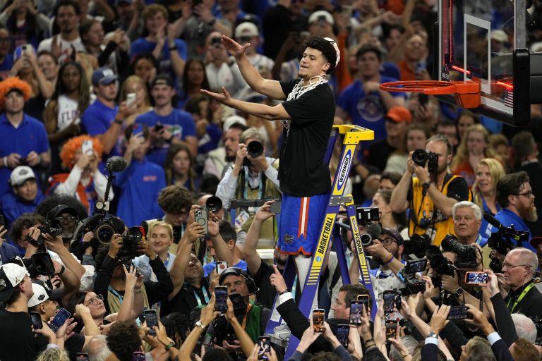 Florida Gators guard Walter Clayton Jr. (1) cuts the net after defeating the Houston Cougars in the national championship game of the Final Four of the 2025 NCAA Tournament at the Alamodome.
