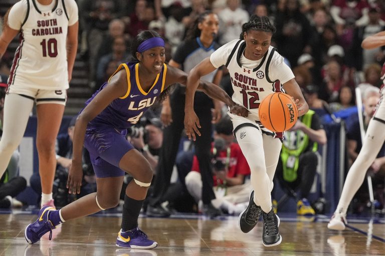 South Carolina Gamecocks guard MiLaysia Fulwiley (12) steals the ball from LSU Lady Tigers guard Flau'jae Johnson (4) during the second half at Bon Secours Wellness Arena.