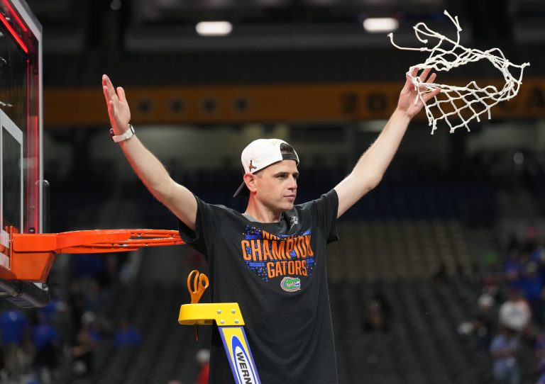Florida Gators head coach Todd Golden cuts down the net after defeating the Houston Cougars in the national championship game of the Final Four of the 2025 NCAA Tournament at the Alamodome.