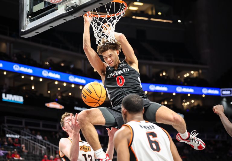 Cincinnati Bearcats guard Dan Skillings Jr. (0) dunks during the second half against the Oklahoma State Cowboys at T-Mobile Center.