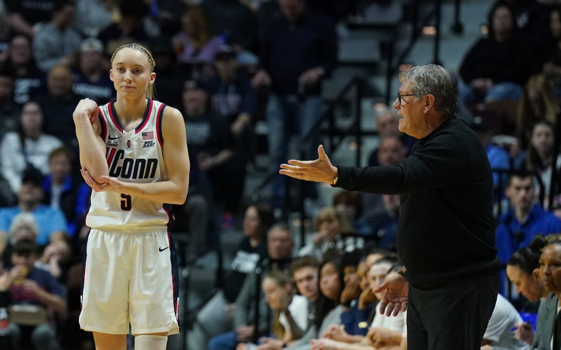 UConn Huskies head coach Geno Auriemma talks to guard Paige Bueckers (5) from the sideline as they take on the St. John's Red Storm at Mohegan Sun Arena.