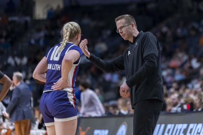 TCU Horned Frogs head coach Mark Campbell works with guard Hailey Van Lith (10) during the second half of an Elite 8 NCAA Tournament basketball game against the Texas Longhorns at Legacy Arena.