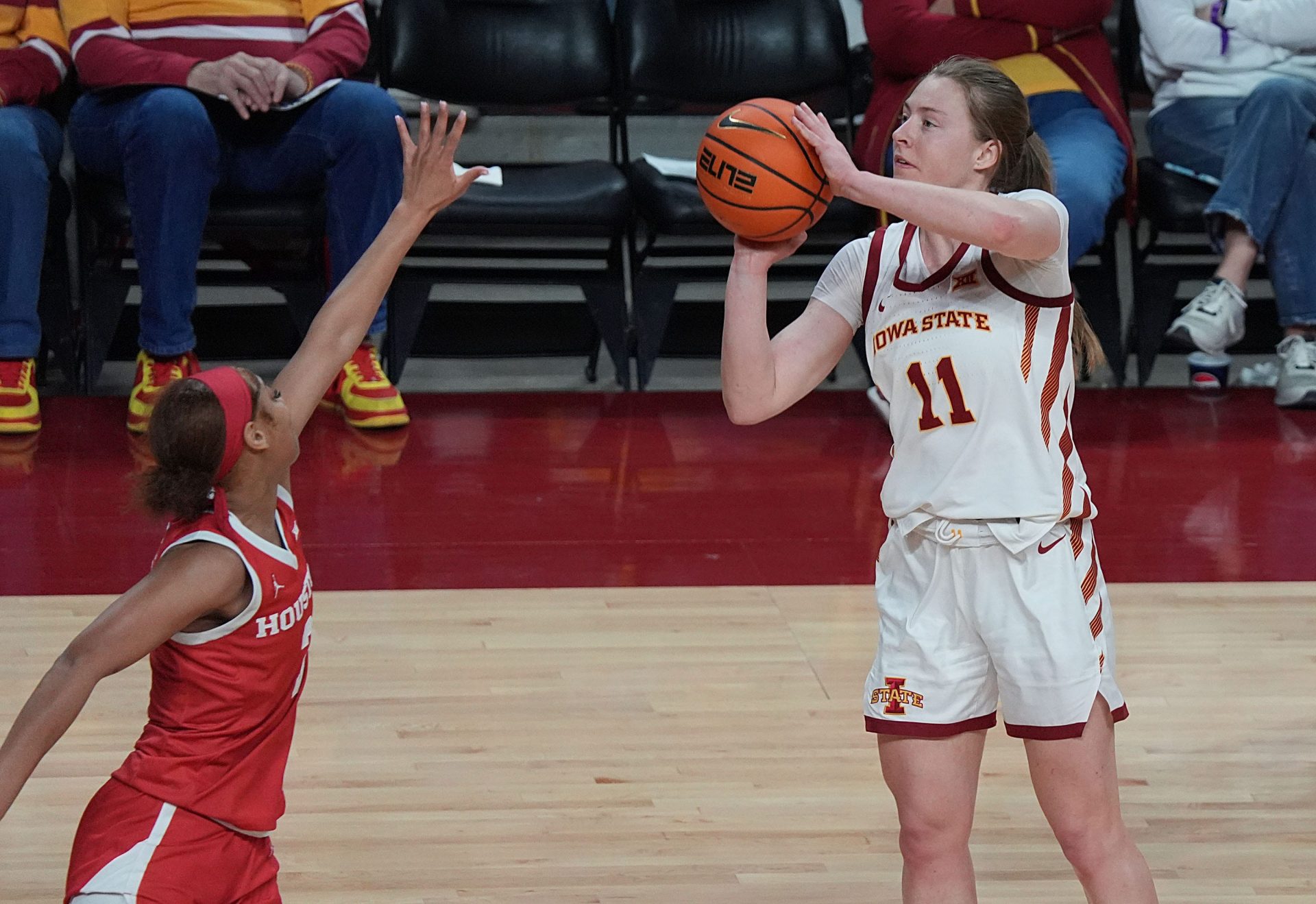 Iowa State Cyclones' guard Emily Ryan (11) takes a three-point shot over Houston Cougars guard Gigi Cooke (3) during the third quarter in the Big-12 women’s basketball