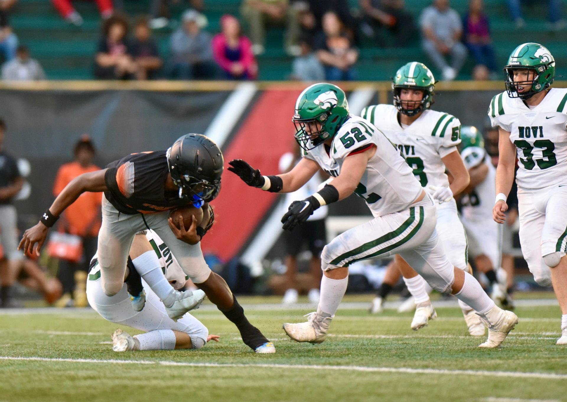 Novi's Preston Phimister sacks Belleville's Bryce Underwood during the Xenith Prep Kickoff Classic on Friday, Aug. 26, 2022, at Wayne State University.

Photo Aug 26 6 39 31 Pm 2