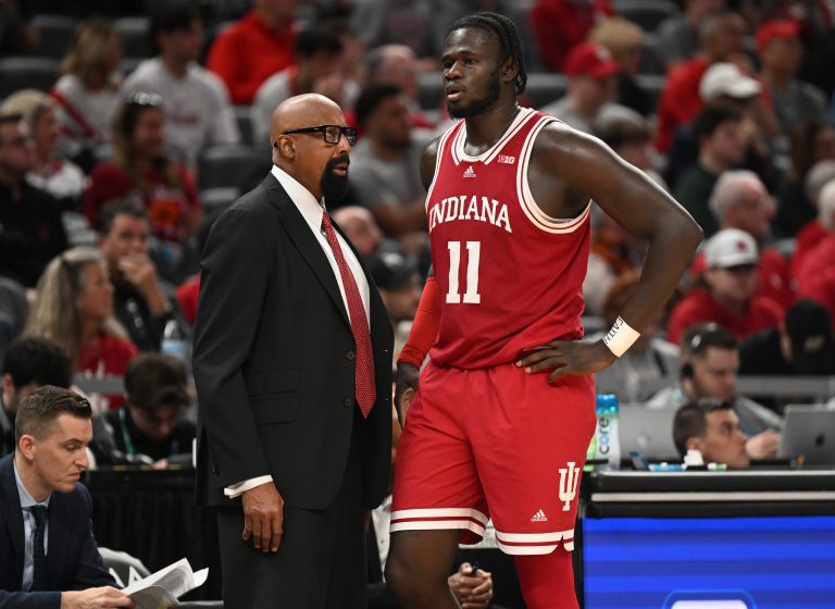 Indiana Hoosiers head coach Mike Woodson talks with Indiana Hoosiers center Oumar Ballo (11) during the second half against the Oregon Ducks at Gainbridge Fieldhouse.