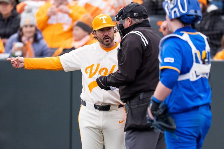 Tennessee head coach Tony Vitello talks to an umpire during a college baseball game between Tennessee and Hofstra