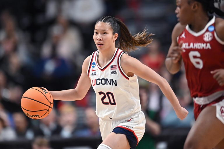 UConn Huskies guard Kaitlyn Chen (20) controls the ball against the Oklahoma Sooners during the first half of a Sweet 16 NCAA Tournament basketball game at Spokane Arena. at Spokane Arena.