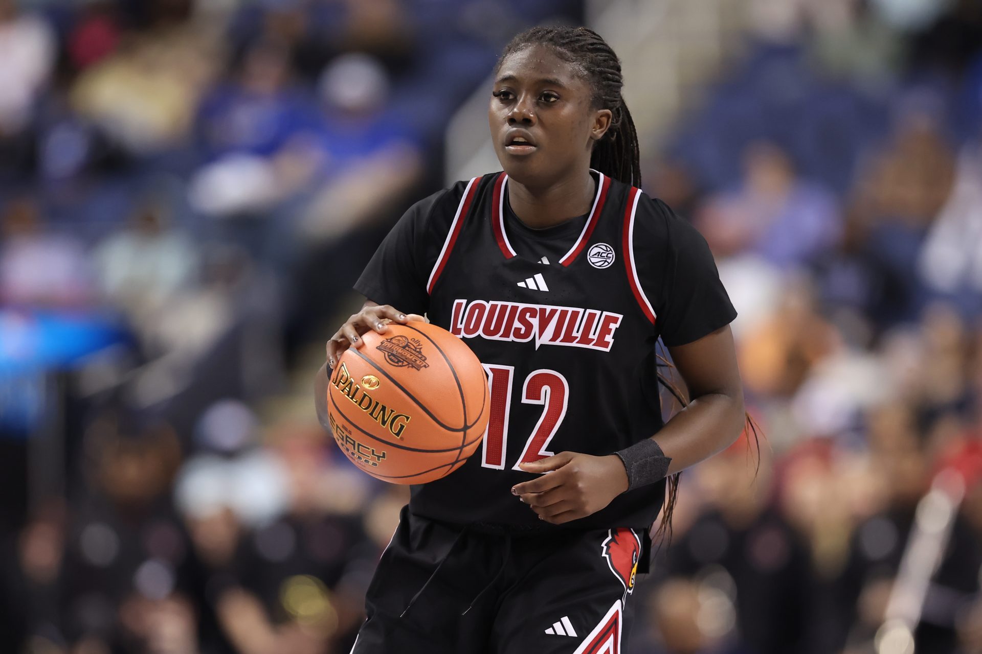 Louisville Cardinals guard Ja'Leah Williams (12) sets the play during the second quarter against Duke Blue Devils at First Horizon Coliseum.