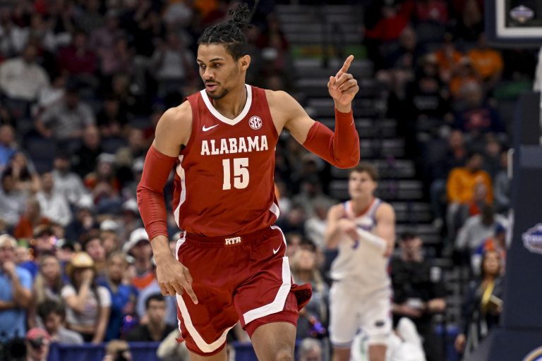 Alabama Crimson Tide forward Jarin Stevenson (15) reacts after a made three point basket against the Florida Gators during the first half at Bridgestone Arena.