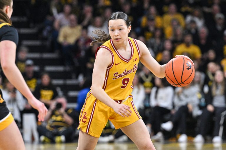 USC Trojans guard Kayleigh Heckel (9) controls the ball against the USC Trojans during the first quarter at Carver-Hawkeye Arena.