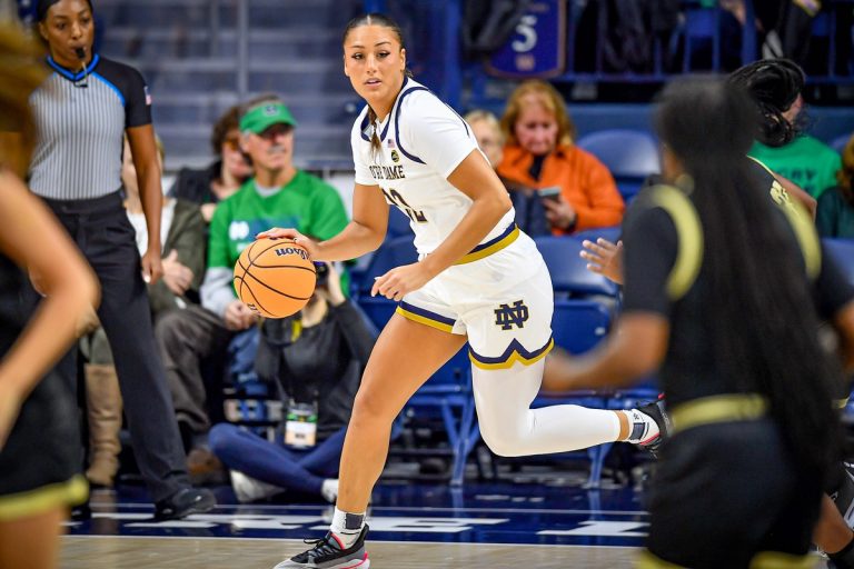 Notre Dame Fighting Irish forward Kylee Watson (22) dribbles in the first half