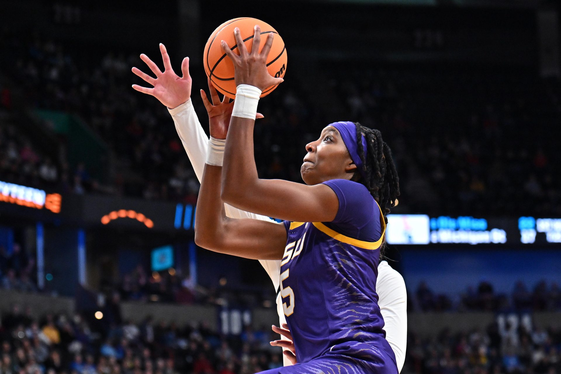 LSU Lady Tigers forward Sa'Myah Smith (5) shoots against NC State Wolfpack forward Tilda Trygger (18) during the first half of a Sweet 16 NCAA Tournament basketball game at Spokane Arena.