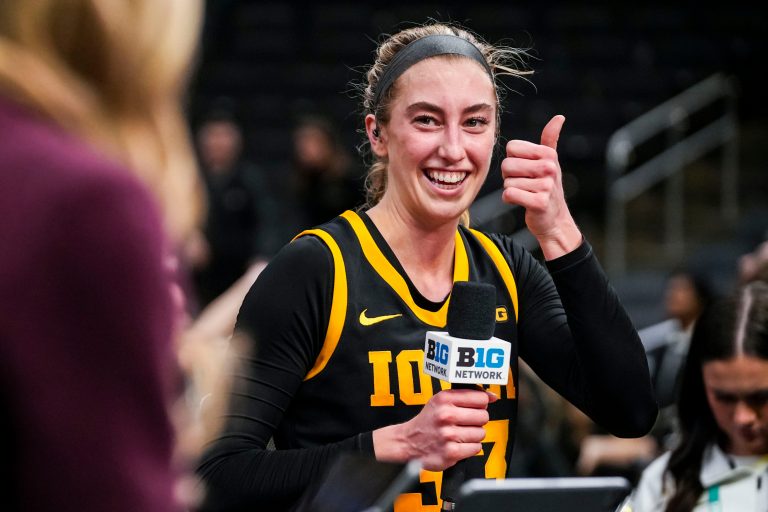 Iowa Hawkeyes guard Lucy Olsen (33) prepares for an interview Thursday, March 6, 2025, in a round two game at the 2025 TIAA Big Ten Women's Basketball Tournament between the Iowa Hawkeyes and the Michigan State Spartans at Gainbridge Fieldhouse in Indianapolis.