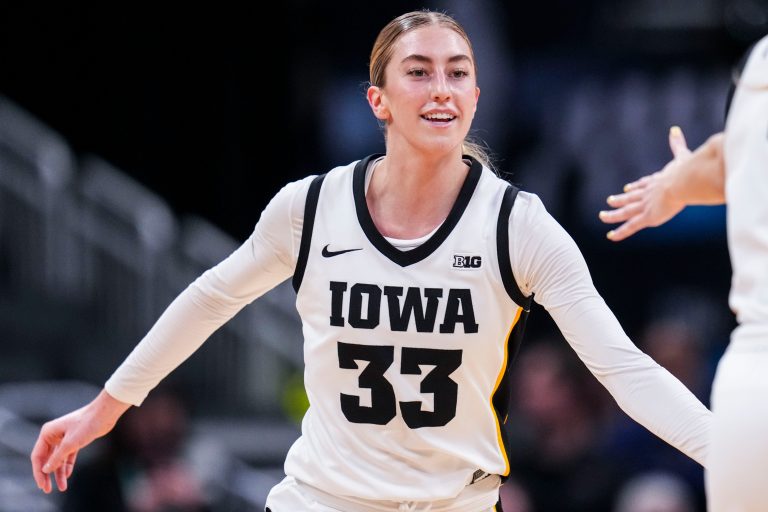 Iowa Hawkeyes guard Lucy Olsen (33) smiles after scoring Wednesday, March 5, 2025, in a round one game at the 2025 TIAA Big Ten Women's Basketball Tournament between the Iowa Hawkeyes and the Wisconsin Badgers