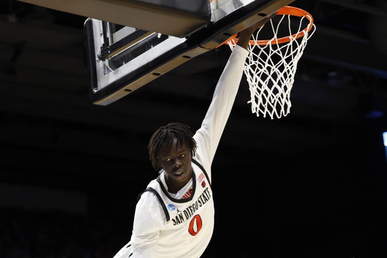 San Diego State Aztecs forward Magoon Gwath (0) hangs from the basket in the first half against the North Carolina Tar Heels at UD Arena.
