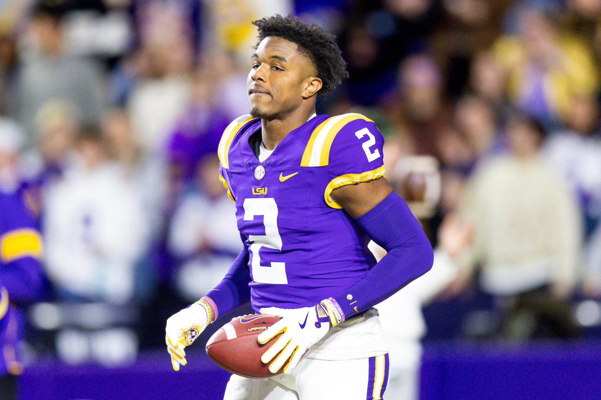 LSU Tigers wide receiver Kyren Lacy (2) hugs head coach Brian Kelly as seniors are being honored during the beginning of the first quarter at Tiger Stadium