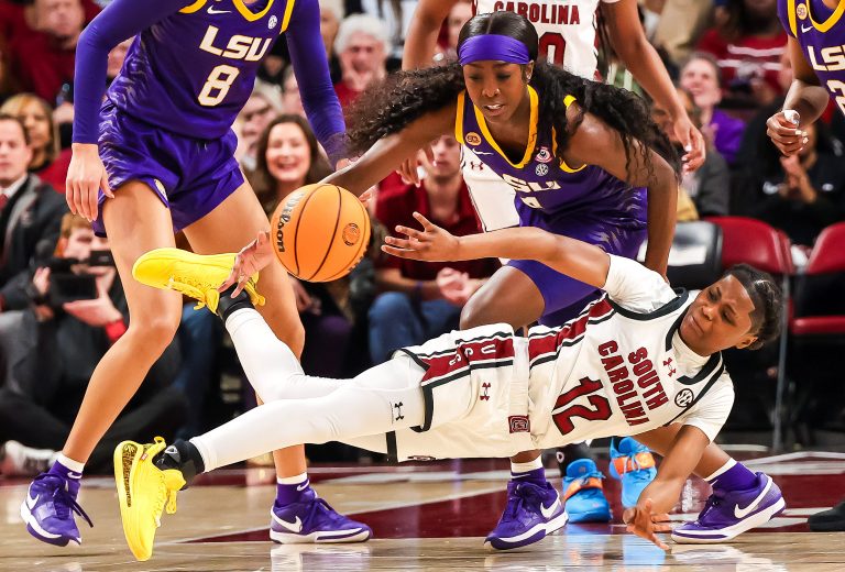 South Carolina Gamecocks guard MiLaysia Fulwiley (12) passes away from LSU Lady Tigers guard Flau'Jae Johnson (4) in the first half at Colonial Life Arena.