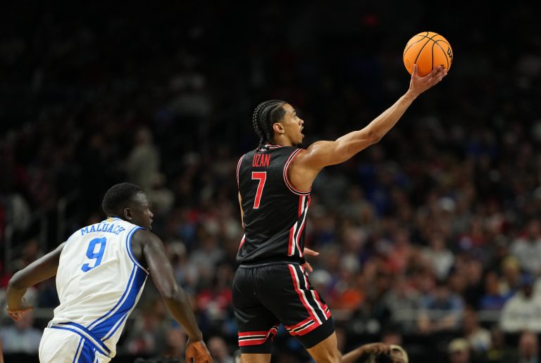 Houston Cougars guard Milos Uzan (7) shoots the ball against the Duke Blue Devils during the second half in the semifinals of the men's Final Four of the 2025 NCAA Tournament at the Alamodome.