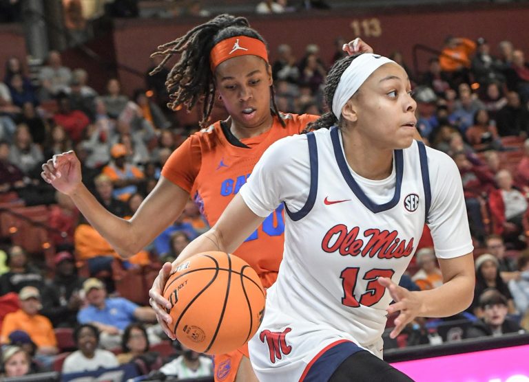 Ole Miss guard Mariyah Noel (13) dribbles by Florida guard Jeriah Warren (20) during the first quarter of the SEC Women's Basketball Tournament