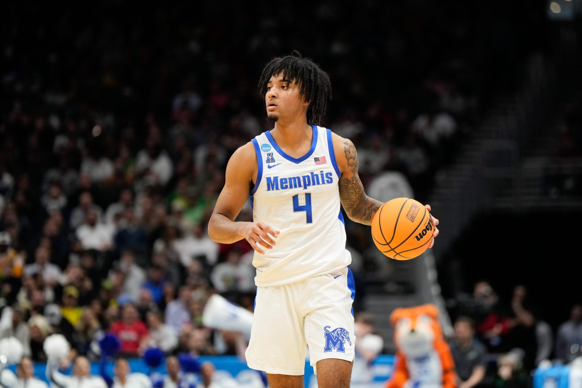 Memphis Tigers guard PJ Haggerty (4) looks for an open player during the first half against Colorado State Rams at Climate Pledge Arena.
