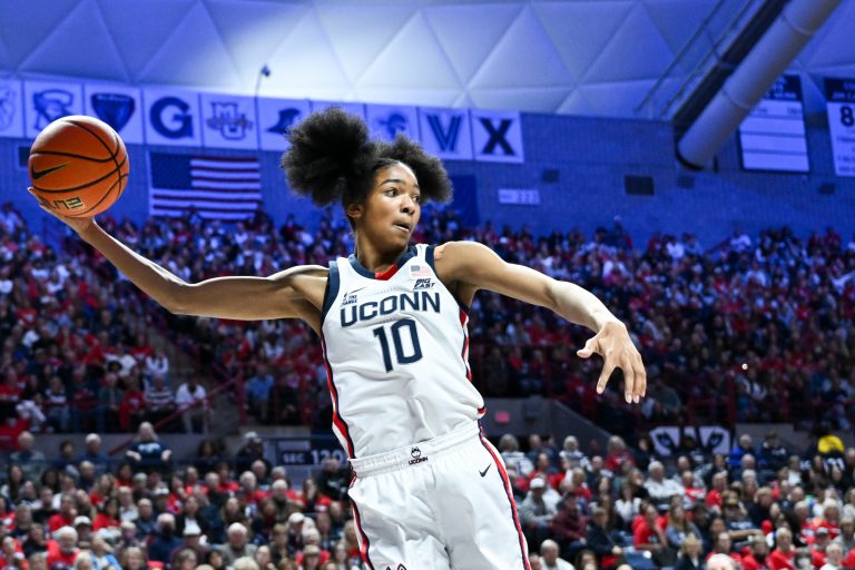 Connecticut Huskies guard Qadence Samuels (10) leaps to keep the ball inbounds during the second half against the Fairleigh Dickinson Knights at Harry A. Gampel Pavilion.