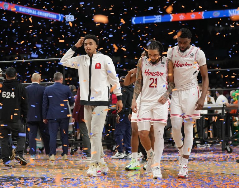 Houston Cougars guard Emanuel Sharp (21) and teammates walk off the court after losing to the Florida Gators in the national championship game of the Final Four of the 2025 NCAA Tournament at the Alamodome.