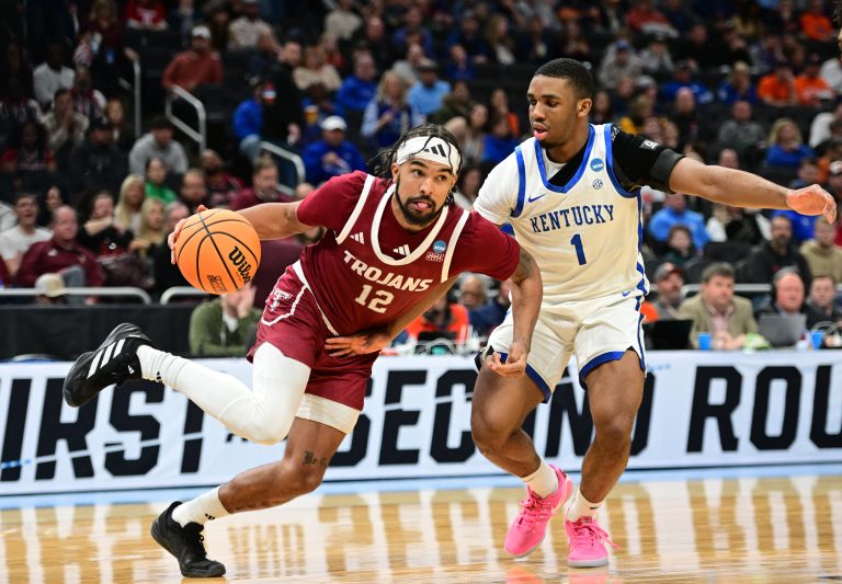 Troy Trojans guard Tayton Conerway (12) drives to the hoop past Kentucky Wildcats guard Lamont Butler (1) during the second half at Fiserv Forum.