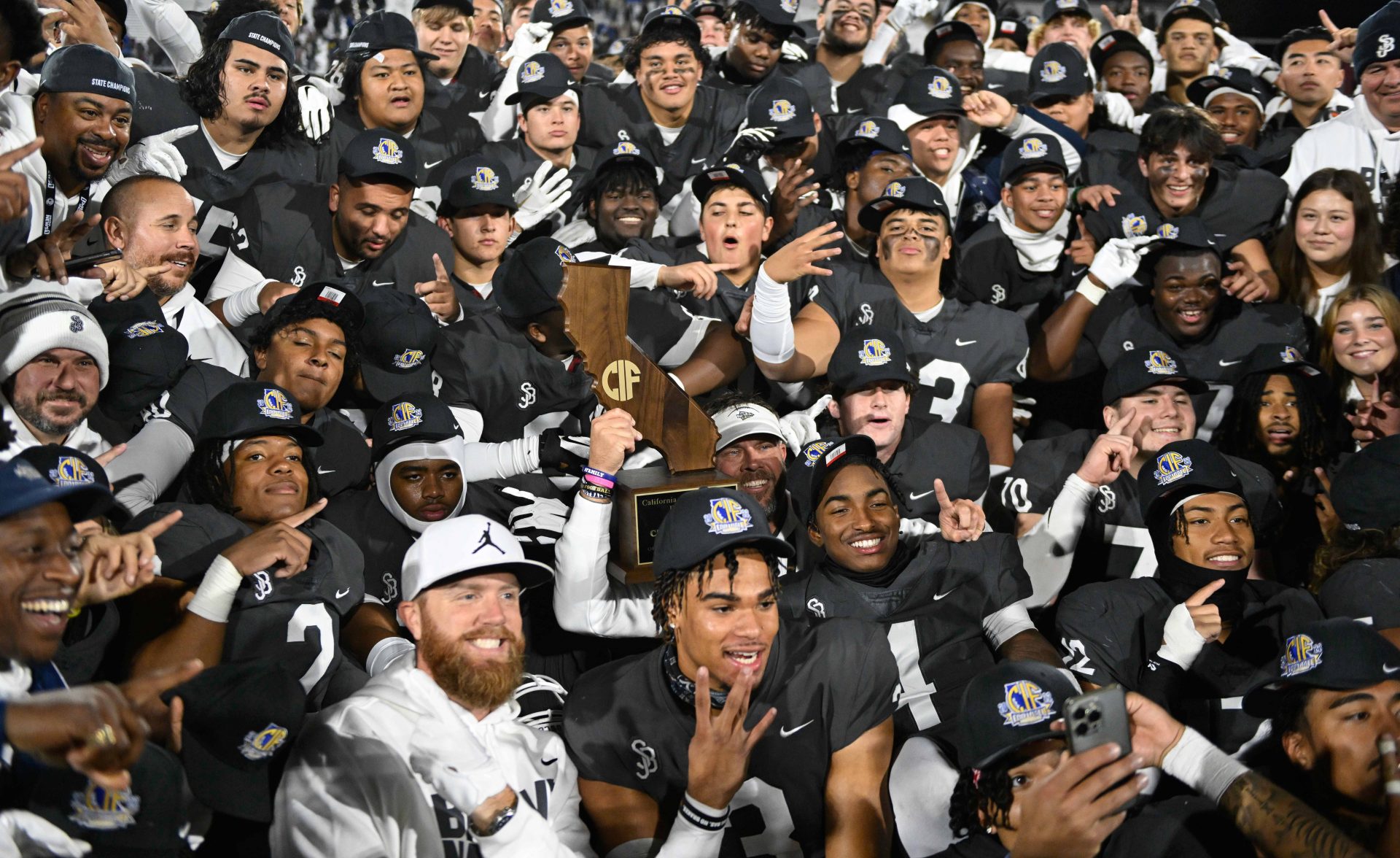 St. John Bosco High celebrates beating Serra Padres 45-0 in the CIF State Football Championship Open Division Bowl at Saddleback College. Going into the game St. John Bosco was the #1 ranked high school football team in the USA.
