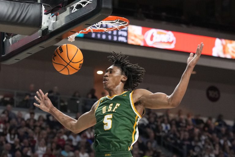 uard Tyrone Riley IV (5) dunks the basketball against the Gonzaga Bulldogs during the second half in the semifinal of the West Coast Conference tournament at Orleans Arena.