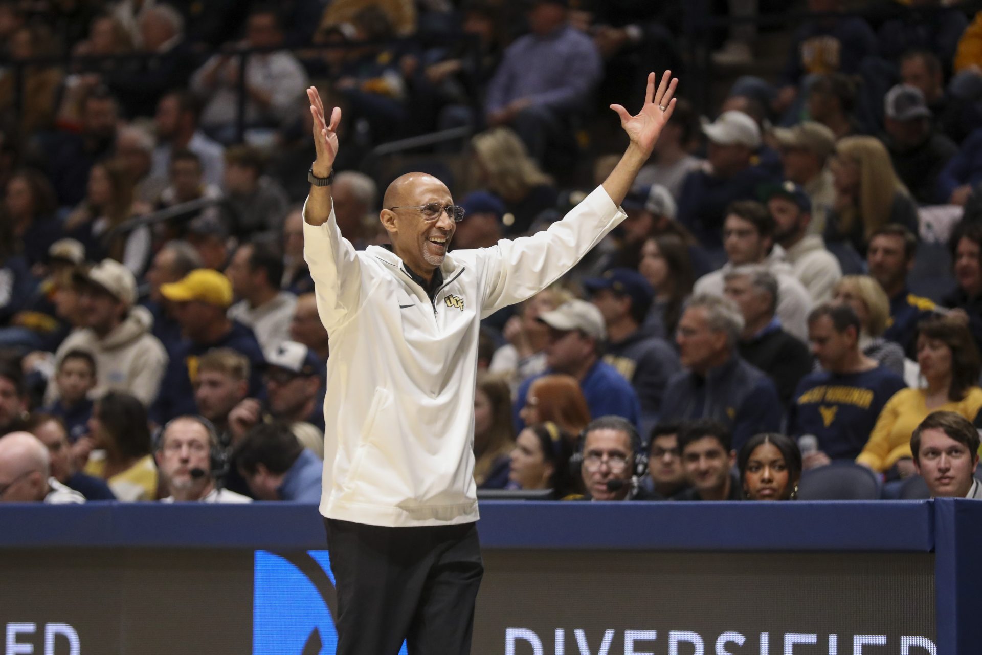 UCF Knights head coach Johnny Dawkins argues a call during the first half against the West Virginia Mountaineers at WVU Coliseum.