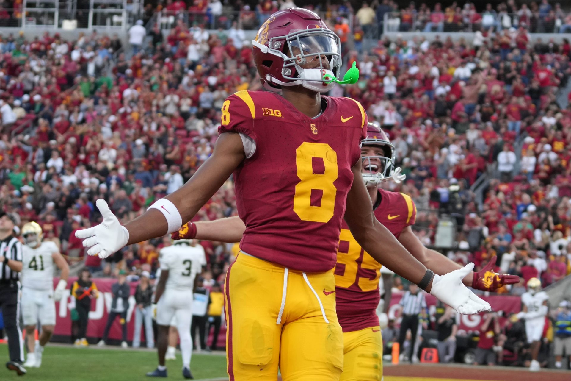 Southern California Trojans wide receiver Ja'Kobi Lane (8) celebrates after scoring on a 6-yard touchdown reception against the Notre Dame Fighting Irish in the second half at United Airlines Field at Los Angeles Memorial Coliseum.