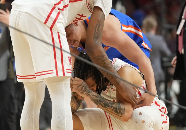 Houston Cougars guard Emanuel Sharp (right) reacts after losing to the Florida Gators in the national championship game of the Final Four of the 2025 NCAA Tournament at the Alamodome.