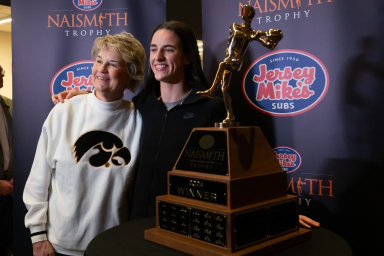 Caitlin Clark of Iowa poses for a photo  with head coach Lisa Bluder after receiving the the award for Naismith Women’s Player of the Year at the Cleveland Browns Stadium Key Bank Club.