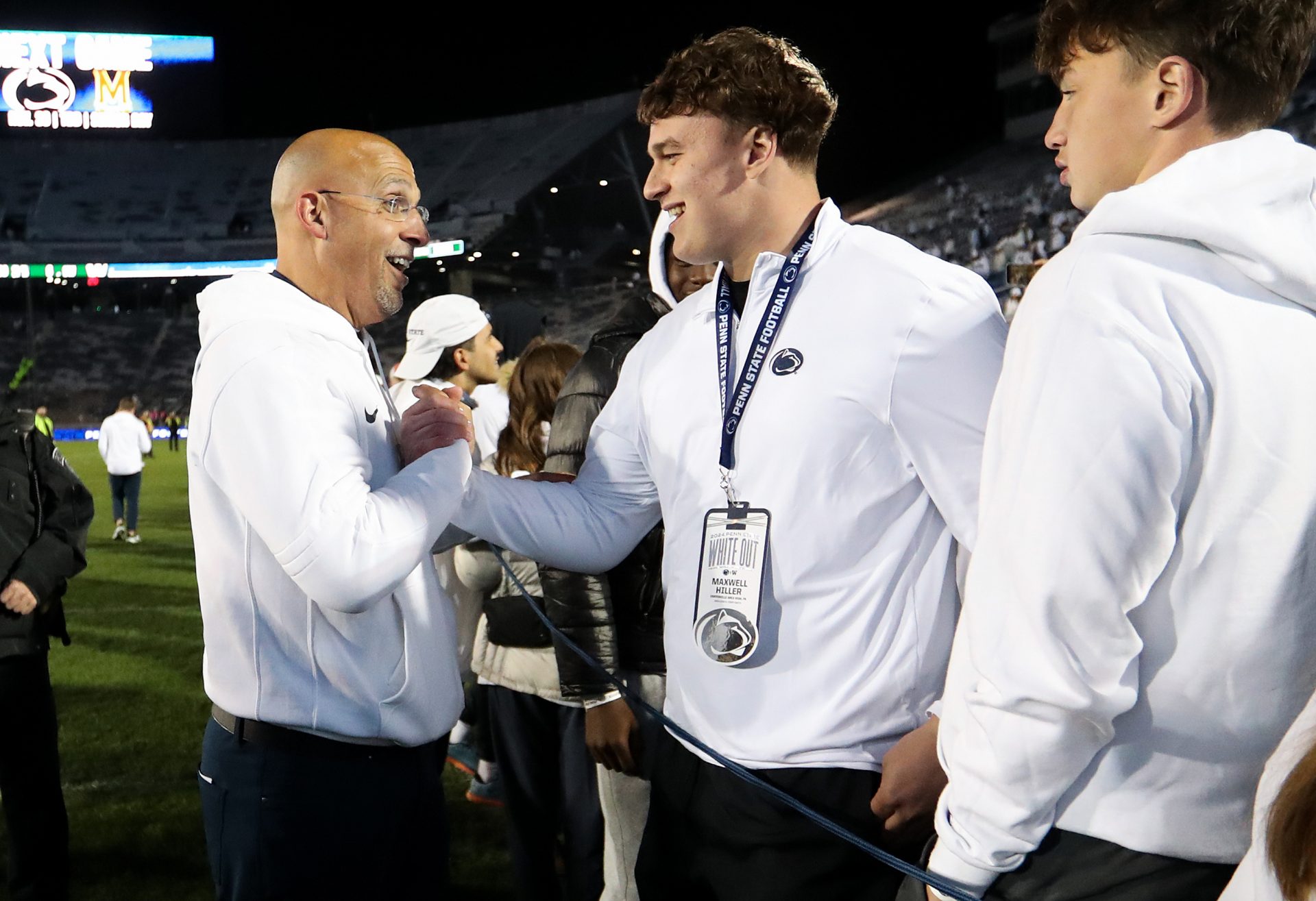 Penn State Nittany Lions head coach James Franklin shakes the hand of a recruit following a game against the Washington Huskies at Beaver Stadium. Penn State won 35-6.