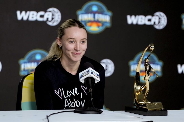 UConn guard Paige Bueckers speaks after receiving the Wade Trophy during press conference at Amalie Arena.