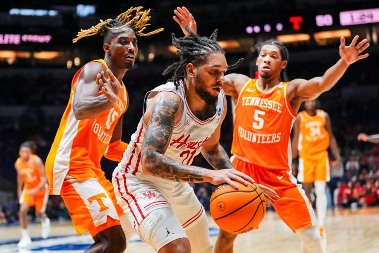 Tennessee guard Jahmai Mashack (15) and Tennessee guard Zakai Zeigler (5) defend Houston guard Emanuel Sharp (21) during a NCAA Tournament Elite Eight