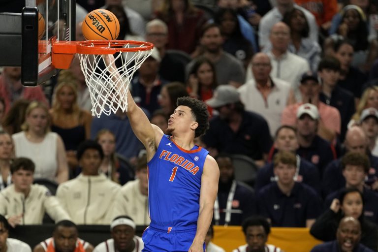 Florida Gators guard Walter Clayton Jr. (1) shoots the ball against the Auburn Tigers during the first half in the semifinals of the men's Final Four of the 2025 NCAA Tournament at Alamodome.