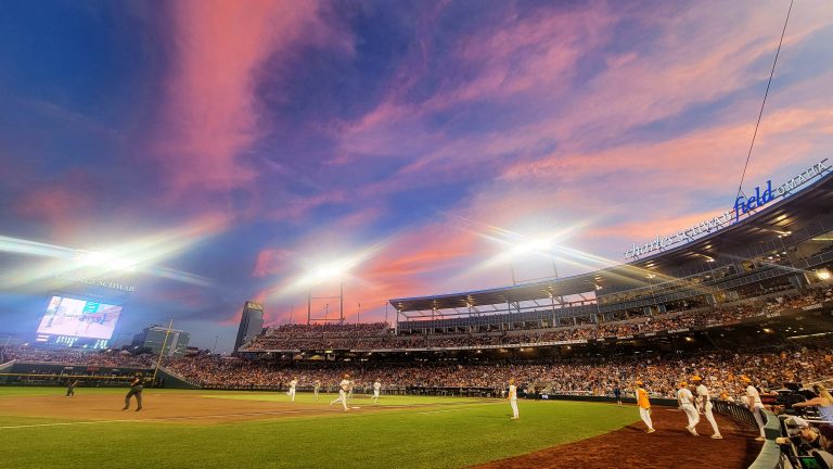A cotton candy sky is seen from the third base photographers well during game one of the NCAA College World Series finals at Charles Schwab Field in Omaha