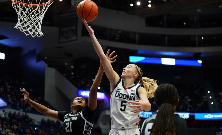 UConn Huskies guard Paige Bueckers (5) makes the basket against Georgetown Hoyas center Ariel Jenkins (21) in the second half at XL Center.