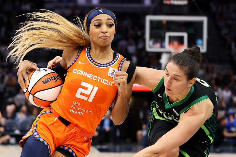 Connecticut Sun guard DiJonai Carrington (21) works around Minnesota Lynx forward Cecilia Zandalasini (9) during the second half of game two of the 2024 WNBA Semi-finals at Target Center.
