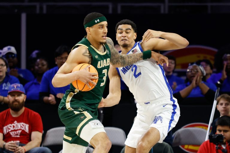 UAB Blazers forward Yaxel Lendeborg (3) drives to the basket as Memphis Tigers forward Nicholas Jourdain (2) defends during the first half at Dickies Arena.