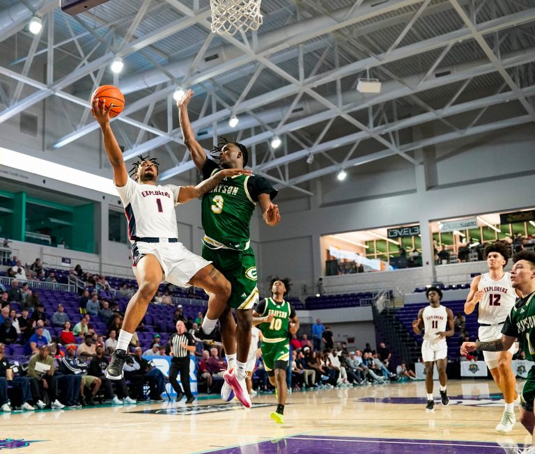Columbus Explorers guard Cello Jackson (1) makes a lay up on a breakaway as Grayson Rams guard Caleb Holt (3) tries to defend during the third quarter of a City of Palms Classic quarterfinal game at Suncoast Credit Union Arena in Fort Myers, Fla., on Friday, Dec. 20, 2024.