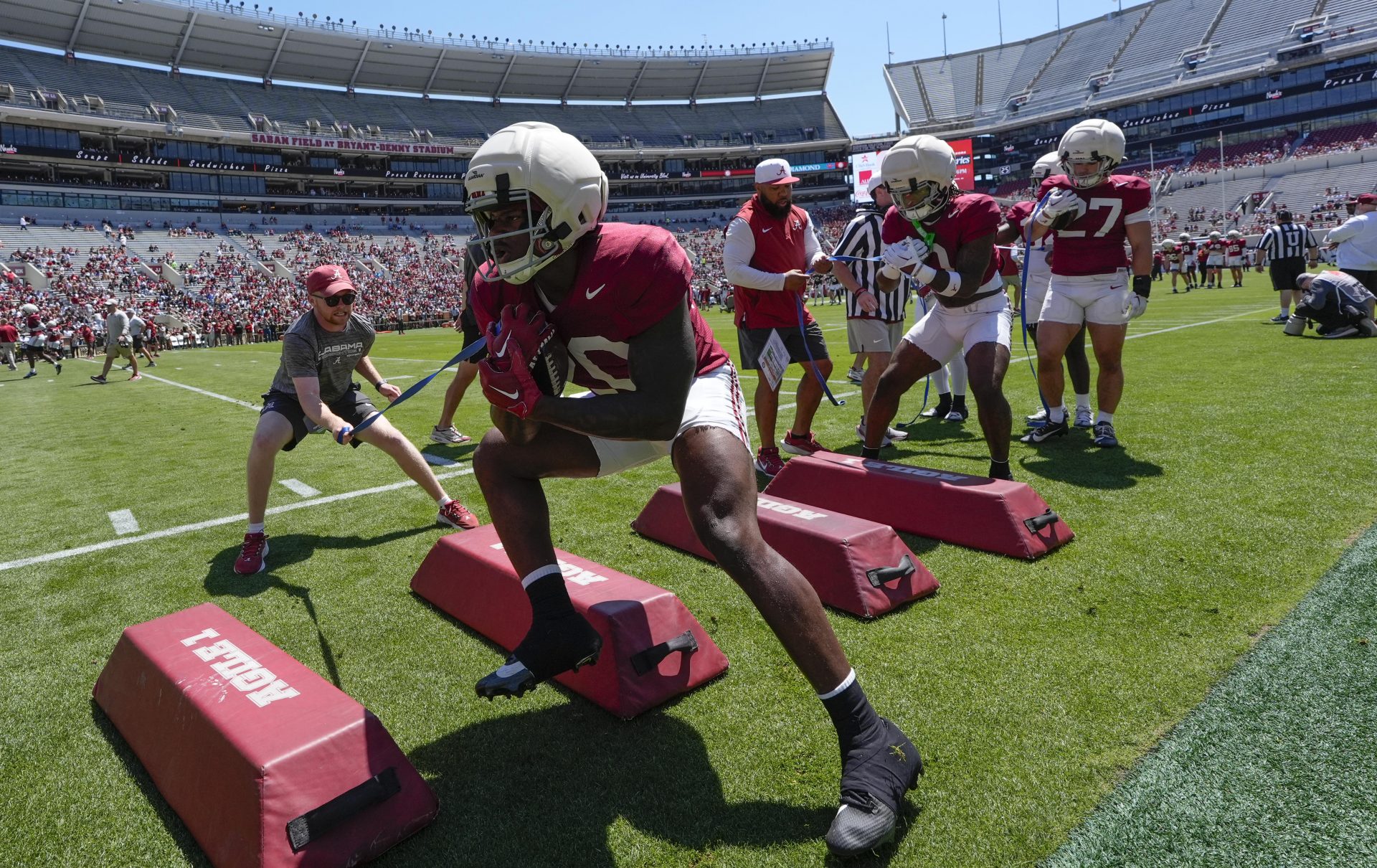 Running back Dre Washington runs a drill during A-Day at Bryant-Denny Stadium.
