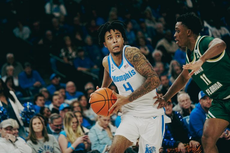 Memphis Tigers’ PJ Haggerty (4) looks to make a move against South Florida’s CJ Brown (11) during a game on Friday, March 7, 2025 at the FedEx Forum in Memphis, Tenn.
