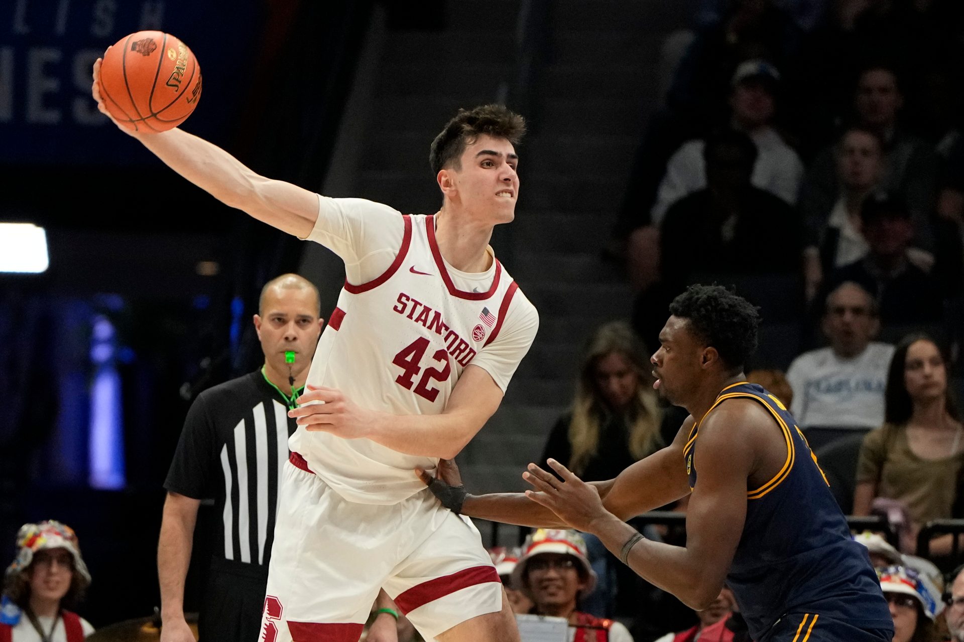 Stanford Cardinal forward Maxime Raynaud (42) passes the ball as California Golden Bears center Mady Sissoko (12) defends in the second half at Spectrum Center.