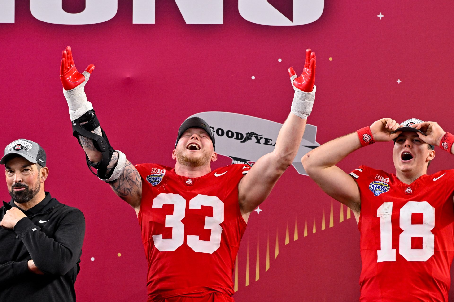 Ohio State Buckeyes defensive end Jack Sawyer (33) and quarterback Will Howard (18) celebrate after the game between the Texas Longhorns and the Ohio State Buckeyes at AT&T Stadium.
