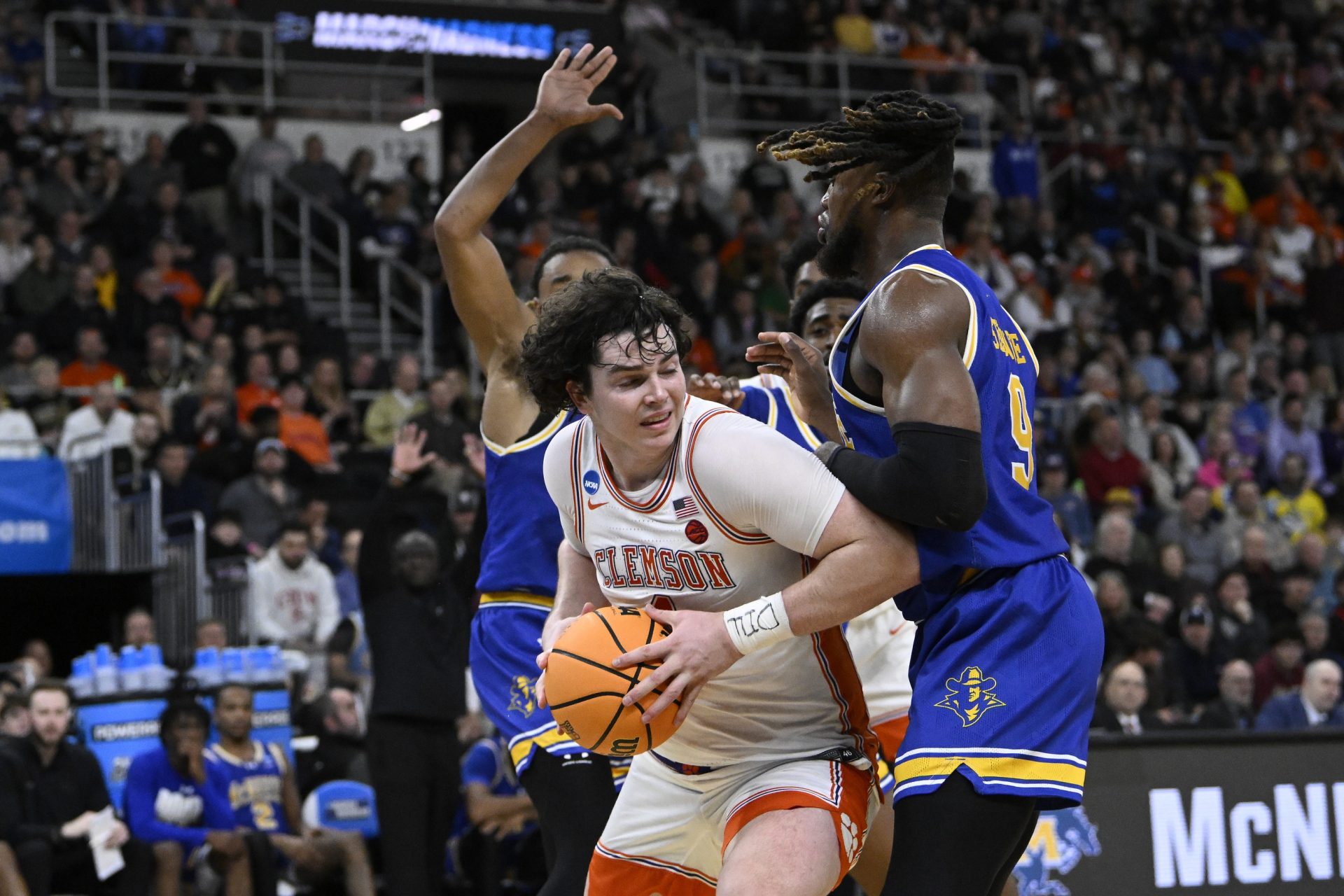 Clemson Tigers forward Ian Schieffelin (4) controls the ball against McNeese State Cowboys forward Bryant Selebangue (9) during the first half at Amica Mutual Pavilion.