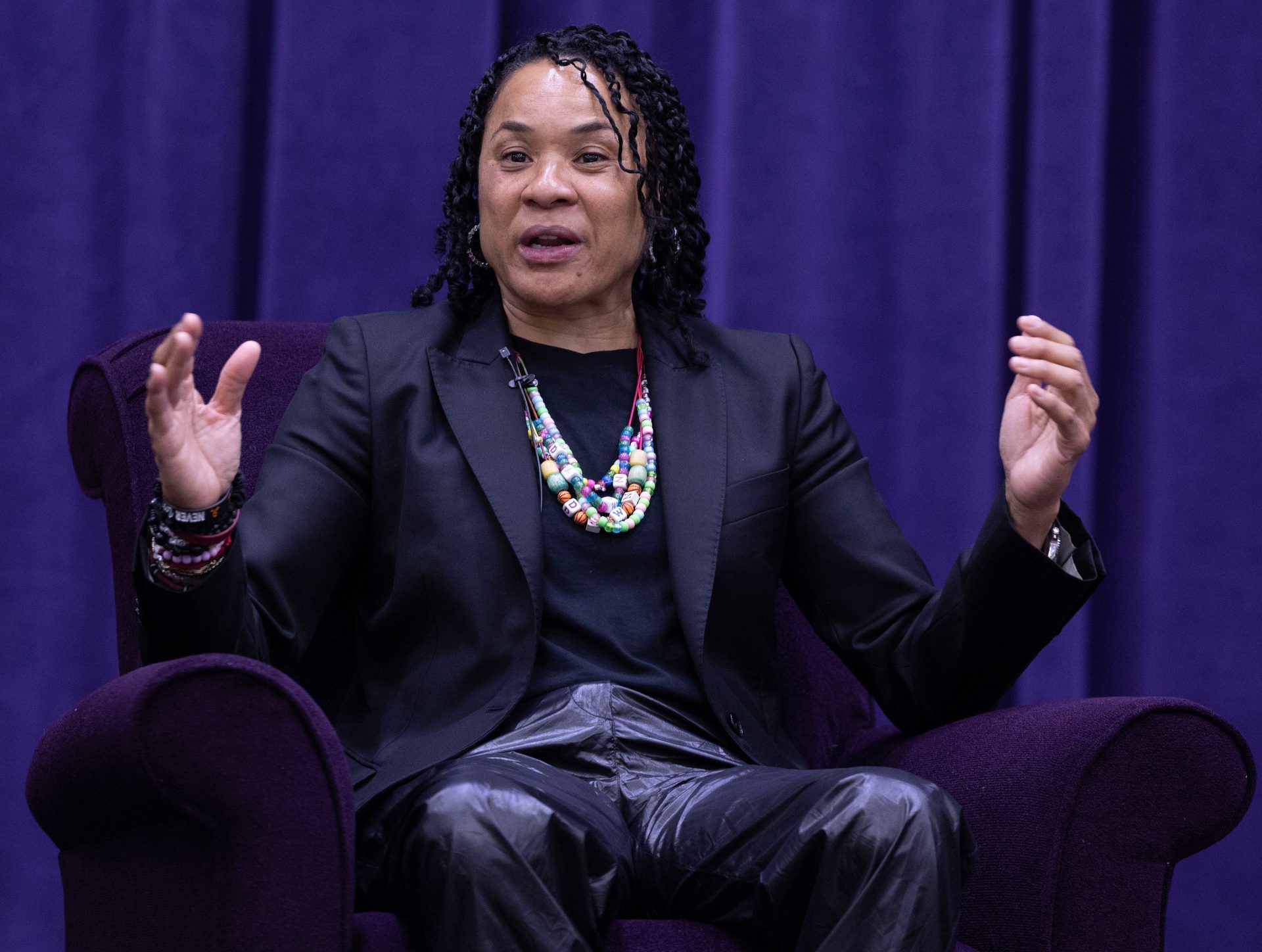 University of South Carolina women's basketball coach Dawn Staley answers a question by moderator Dan Hughes during the University of Mount Union's Schooler Lecture speaker series April 23, 2025, in Alliance, Ohio.